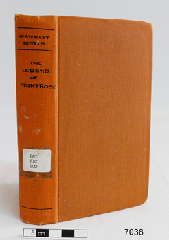 A copper colour hard covered book with the title in black text