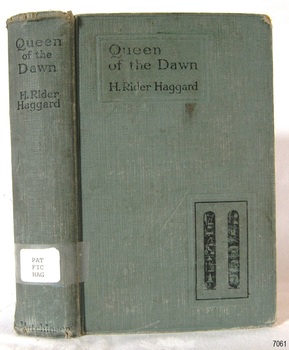Green hardcover book with printed text on spine and cover; cover has hieroglyphics 