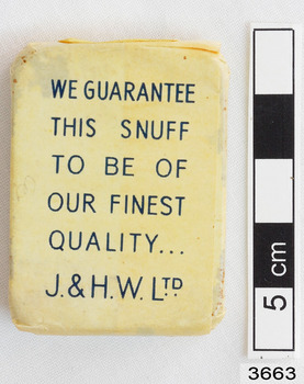 Rear side of the snuff box with words.