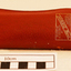 Plastic rimmed reading spectacles in a tan case with printing in gold on the outside showing the maker's name and address.