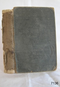 A book of a light navy cover with the cover depicting a roof of a church with the title