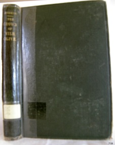 An olive coloured hard covered book with gold font used for the title