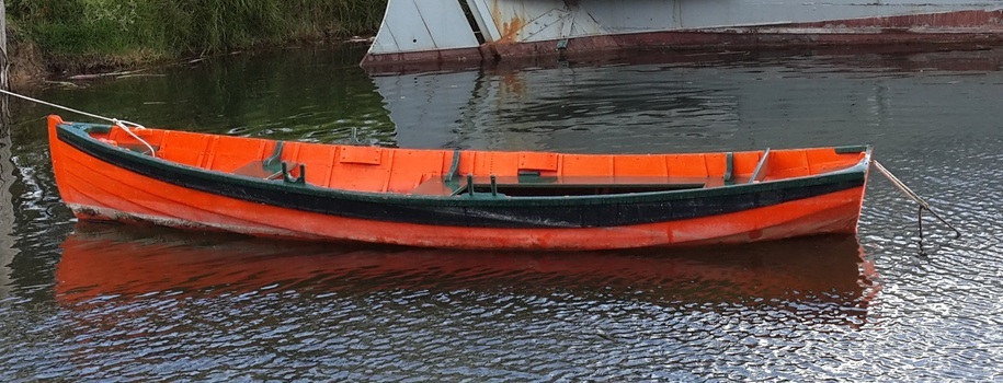 Other side of the boat laying low in the water