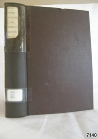 A brown coloured hard cover book