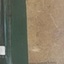 A brown spotted cover with green tape applied to the spine. Title and text is white and black font