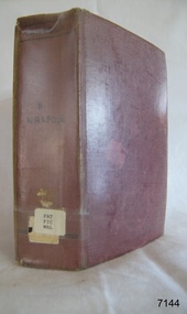 A large book with a red cover