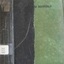 Black and green hard cover with black writing
