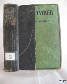 Black and green hard cover with black writing