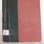 Red hard cover book with black tape, tile in small white font