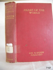 Red hardcover book with gold embossed text on spine and cover