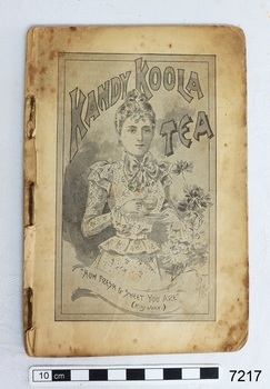 Black and white drawing of a young lady holding a cup and saucer. Her hair is in a bun, her long sleeved dress is light coloured with a small pattern, a large bow at her neck and ruffles at her wrists and waist. Text in a ribbon below the image reads "How frest and sweet your are (King John)" 