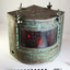 Metal quadrant shaped lamp with red glass on the curve