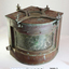 Metal quadrant shaped lamp with green glass on the curve