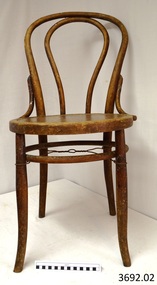 Cane chair has a round bentwood back and bentwood legs stabilised by a strengthening ring inside the legs.
