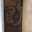 The letter 'N' is stamped inside a circle that is below the outline of a crown