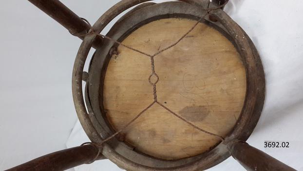 Handwritten inscription on base of chair, 