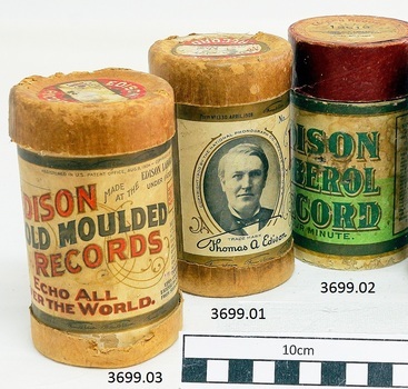 Set of three upright gramophone record cylinders together 