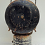 Back of lamp is a round shaped piece of metal