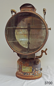 Maker's label is attached to the base of the lamp