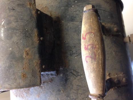 Red handwritten number on wooden handle