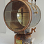 Metal cylinder with glass front mounted on a round fuel tank