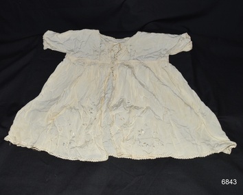 Cream silk baby dress with short sleeves and gathered waist