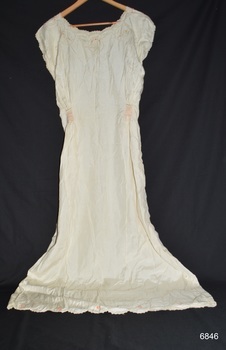 Full length nightgown in cream silk with embroidered design and scalloped edges