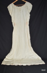 Full length nightgown in cream silk with embroidered design and scalloped edges