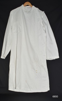 White surgical gown with long sleeves and right breast pocket