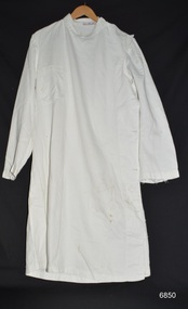 White surgical gown with long sleeves and right breast pocket