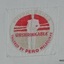 Logo of figure in white, read and gold thread on woven label
