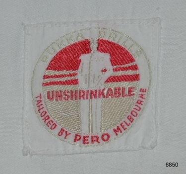 Logo of figure in white, read and gold thread on woven label
