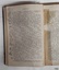 Hand written notations in black pen in margin of page
