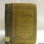 Hardcover book with reinforced spine and white cover with black text