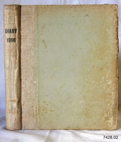 Bound beige hardcovered book with printed title on spine