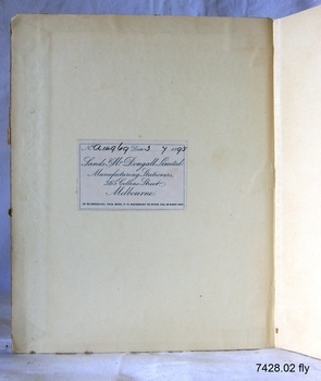 Label with blue print and black handwriting is inside the front cover