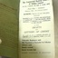 Inside cover page is green with text, fly page has white paper with printed details about the bank.