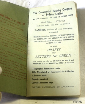 Inside cover page is green with text, fly page has white paper with printed details about the bank.