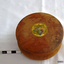 Round wooden box with lid, originally containing lavender soap or powder.