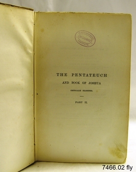 Fly page has printed text, and oval stamp