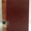Red hardcover book with gold embossed text on spine and pressed text on cover
