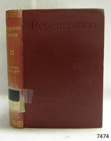 Red hardcover book with gold embossed text on spine and pressed text on cover