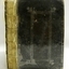 Black hardcover book with embossed border on front cover, spine not covered