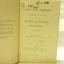 Fly page has black text, black handwritten inscriptions and oval stamp