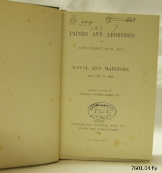 Black print on Fly page, and oval stamp and black handwriting
