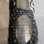 Engraved inscription is within a decorative oval floral wreath