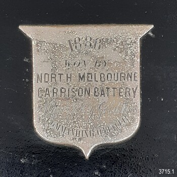 Silver shield engraved with the year's winner