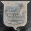 Silver shield on black painted plinth