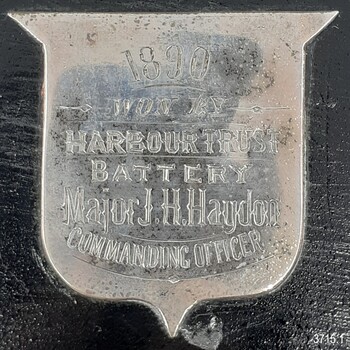Silver shield on black painted plinth