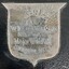 Silver engraved shield on black plinth of trophy